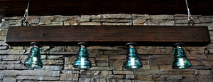 Industrial light fixture with glass insulators
